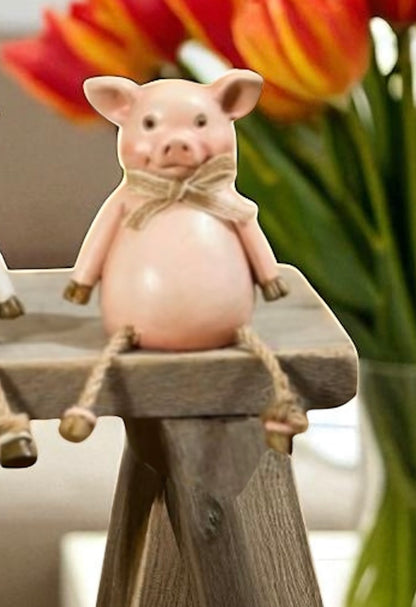 Pig, cow and sheep farm animal shelf sitter ornaments in neutral country style, sitting on a wooden windowsill with dangling legs