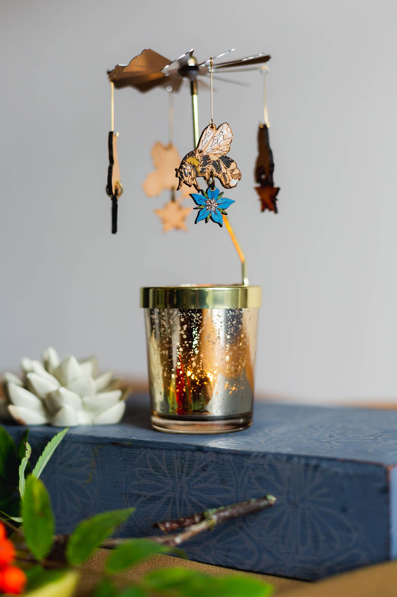 A Candle Carousel - Robin, Bee or Ladybird available to buy from Fig and Rose Home.