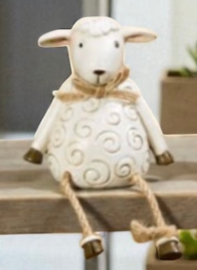 Pig, cow and sheep farm animal shelf sitter ornaments in neutral country style, sitting on a wooden windowsill with dangling legs