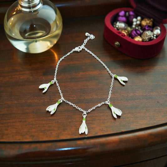 A Snowdrop Charm Bracelet available to buy from Fig and Rose Home.