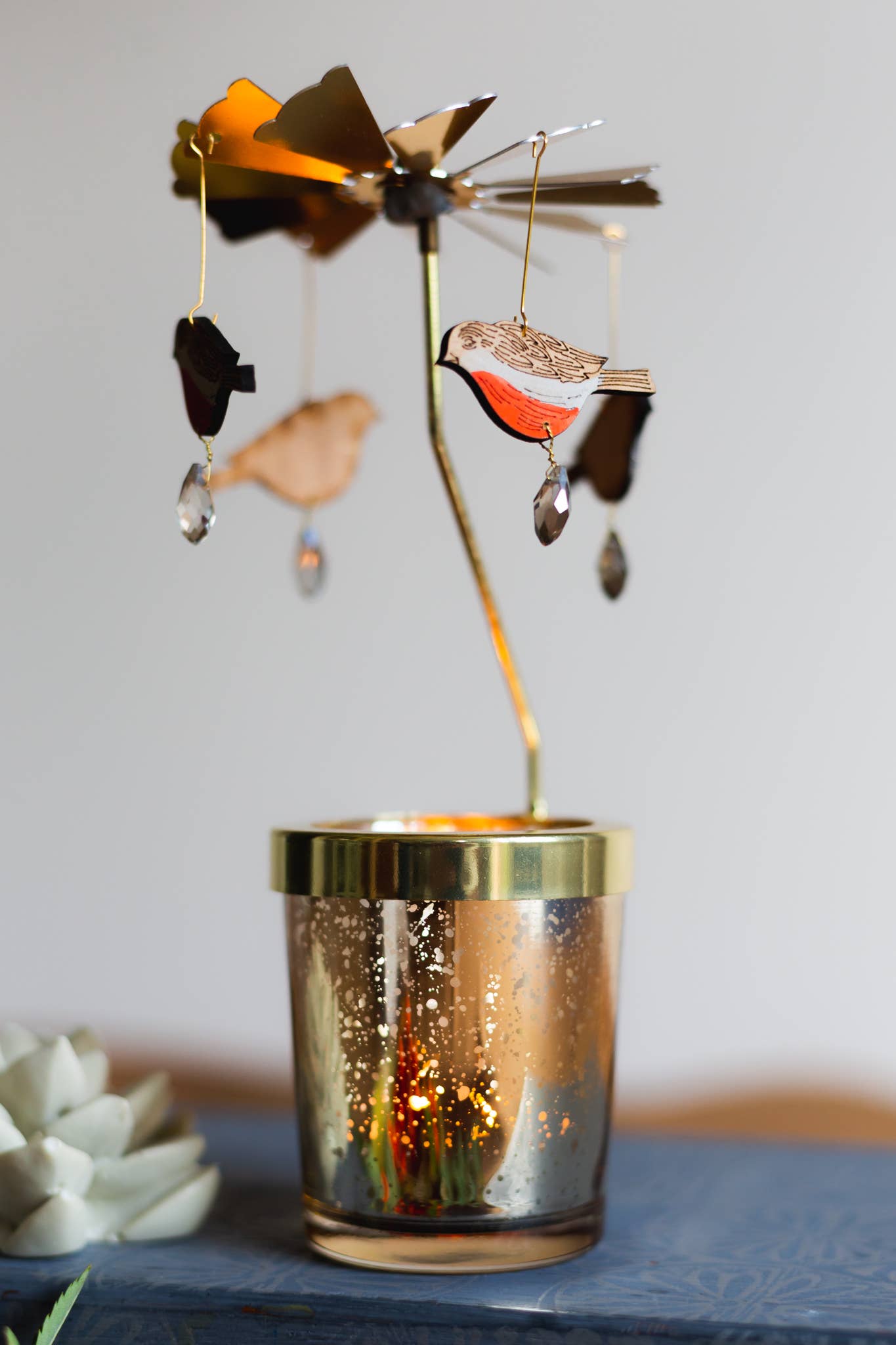A Candle Carousel - Robin, Bee or Ladybird available to buy from Fig and Rose Home.