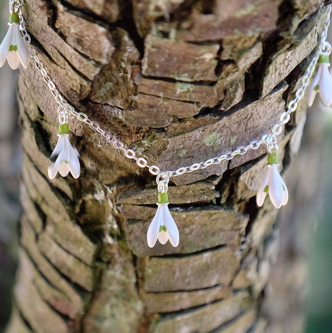 A Snowdrop Charm Bracelet available to buy from Fig and Rose Home.